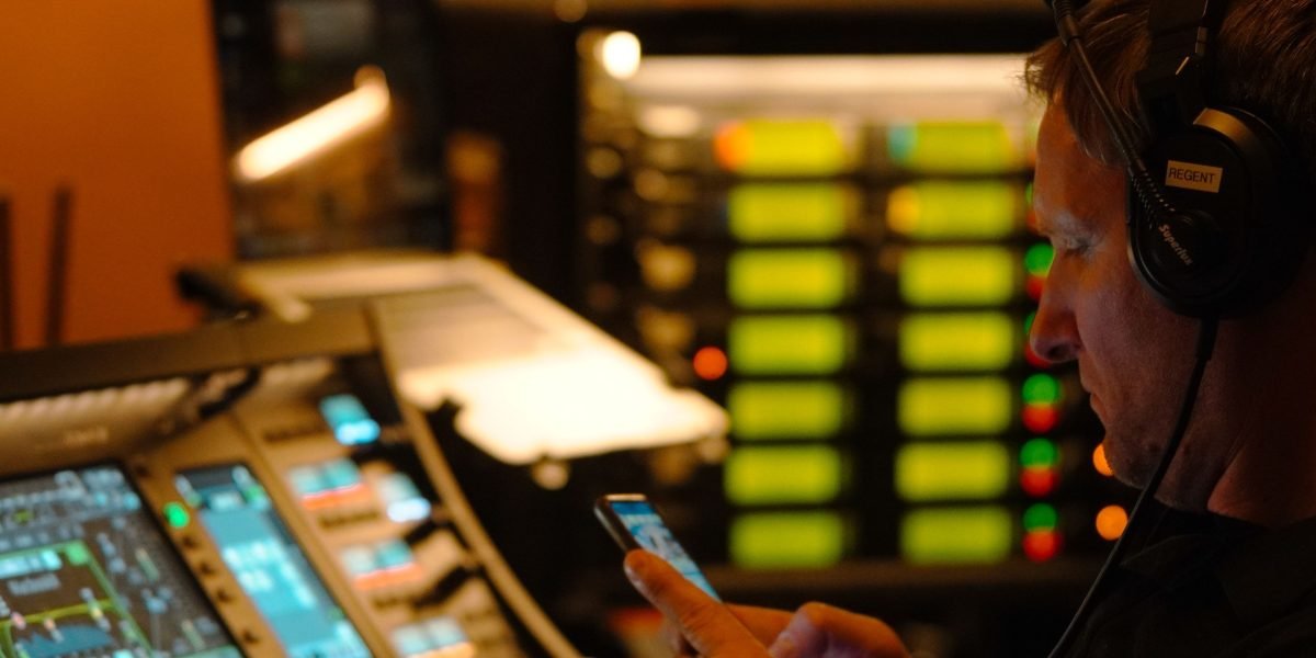 Advanced Video Editing Techniques for Live Sports Production That Cut Costs and Boost Quality 1 Intense focus in a live control room ensuring flawless broadcast.