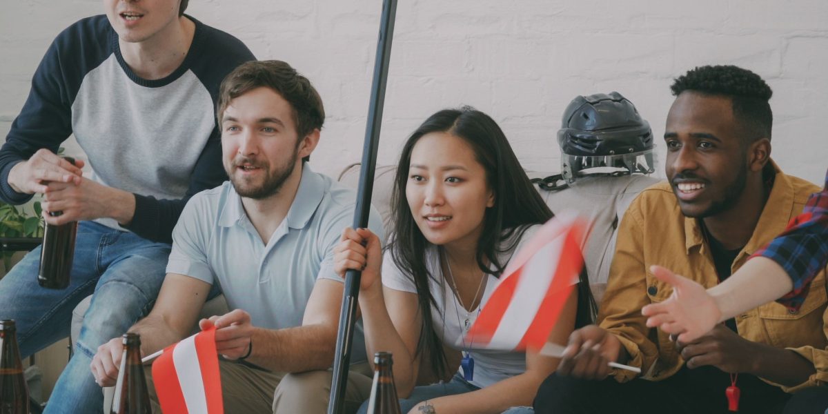How the ESPN Wide World of Sports Complex Sets the Standard for Sports Broadcasting 1 People from diverse backgrounds gathered to watch a live sports broadcast, connecting across continents.