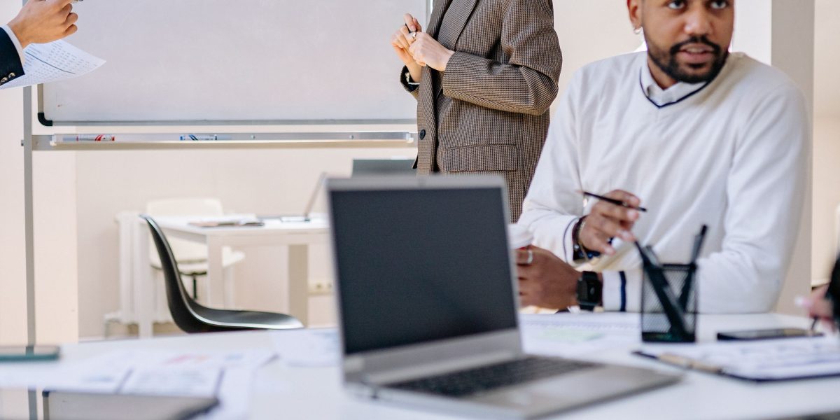 Business leaders making strategic decisions to optimize costs and consolidate vendors for efficient live sports production and unified workflows.