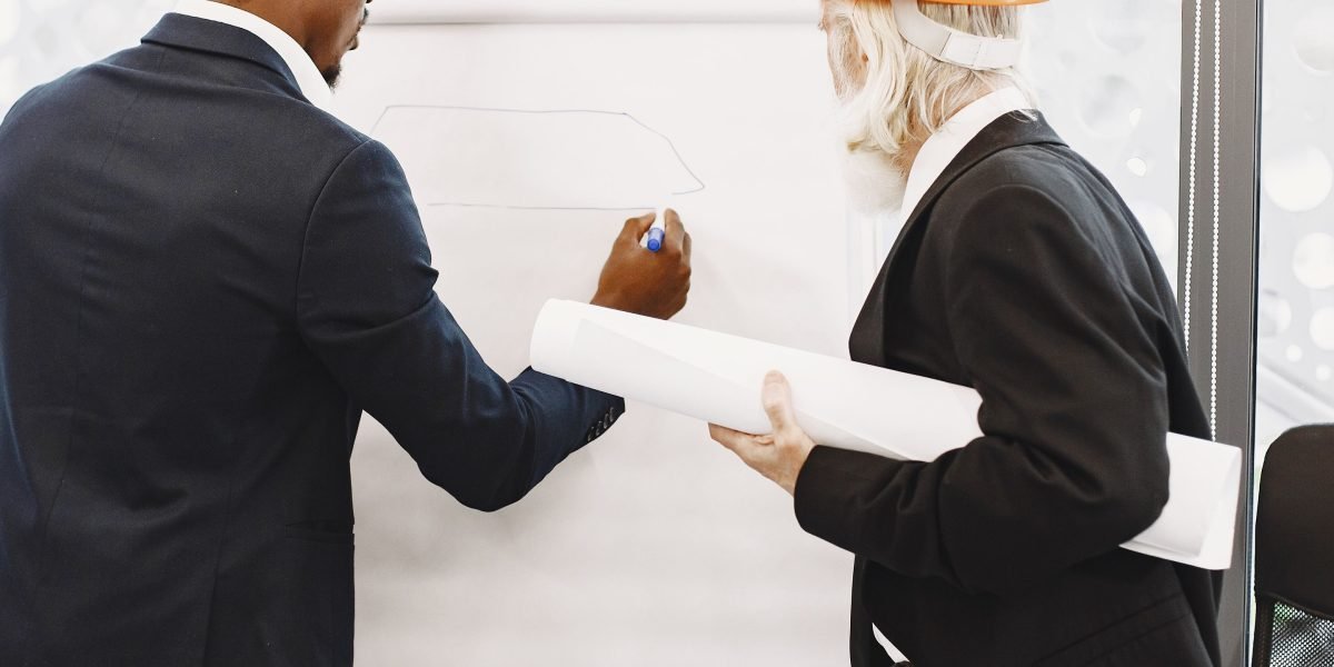 Master Regional and Collegiate Sports Broadcasting for Global Brands 3 A business team actively planning a strategic approach, illustrating the careful consideration required for global expansion.