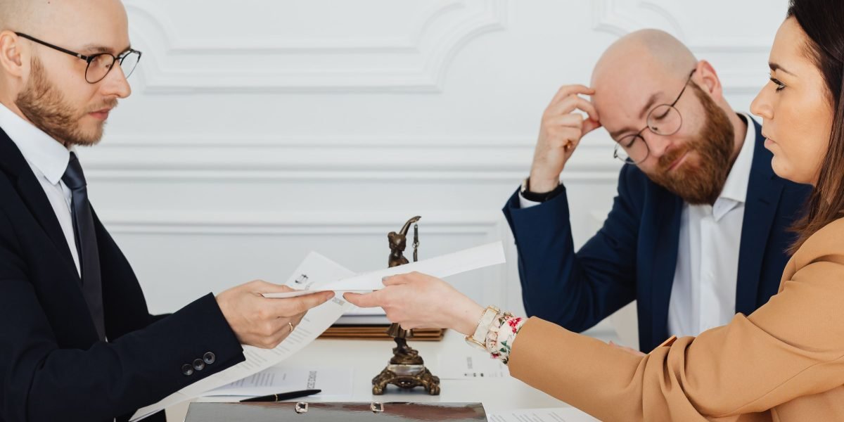 Professionals from different organizations negotiating a broadcast rights deal.