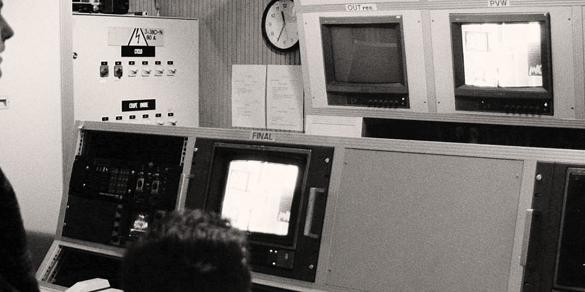 Optimizing College Football Broadcasting for Sports Enterprises 13 A team of production professionals collaborating in a control room during a live event.