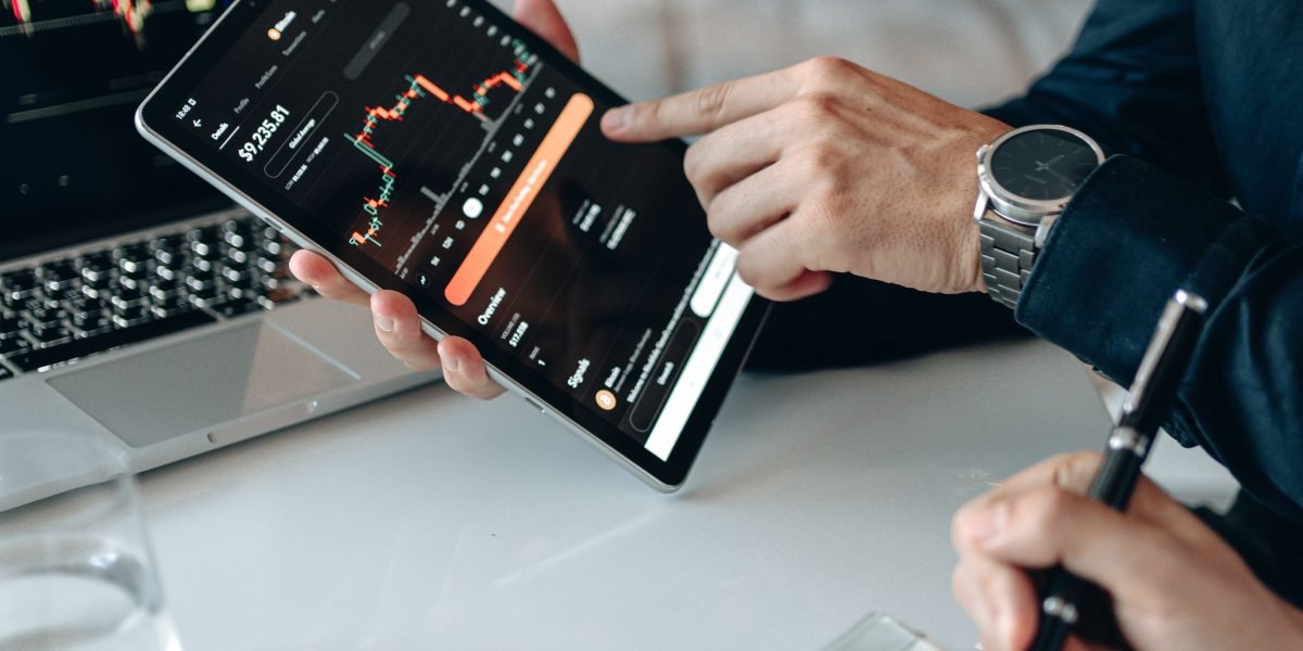 A business professional reviewing charts and data to understand audience behavior and monetization opportunities.