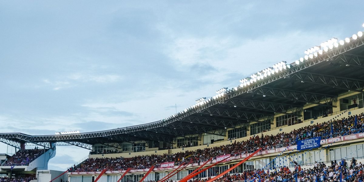 Fans enjoying a live sports broadcast, showcasing the successful outcome of complex technical production and low-latency streaming.