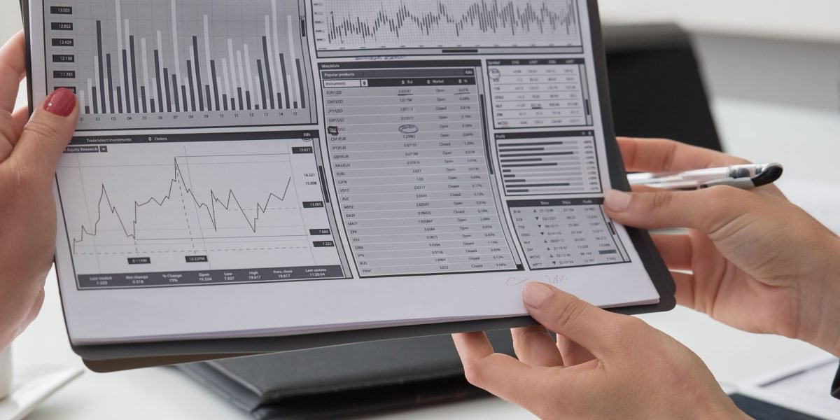 Business professionals analyzing viewership data to optimize audience engagement and revenue for sports broadcasts effectively.