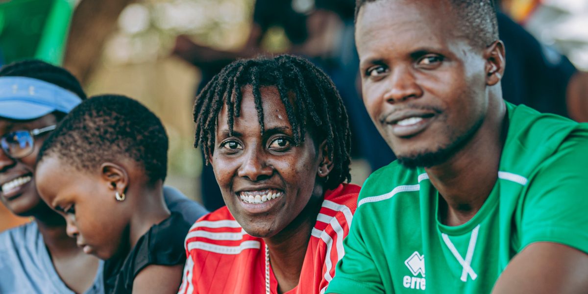 A diverse group of people from different backgrounds united in their enjoyment of a live sports event.